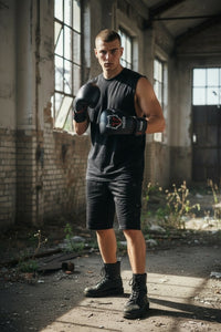Ibn Al Theeb black microfiber boxing gloves with red accents and white wolf graphic