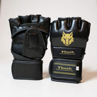My Store Theeb Golden Age kids MMA gloves in black genuine cowhide leather with open finger design and gold wolf logo.