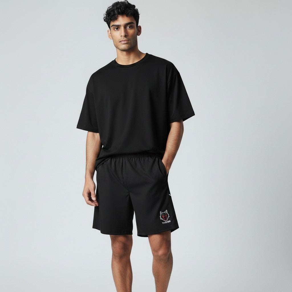 My Store black polyester-spandex gym shorts with elastic waist and wolf logo detail. Designed for training.