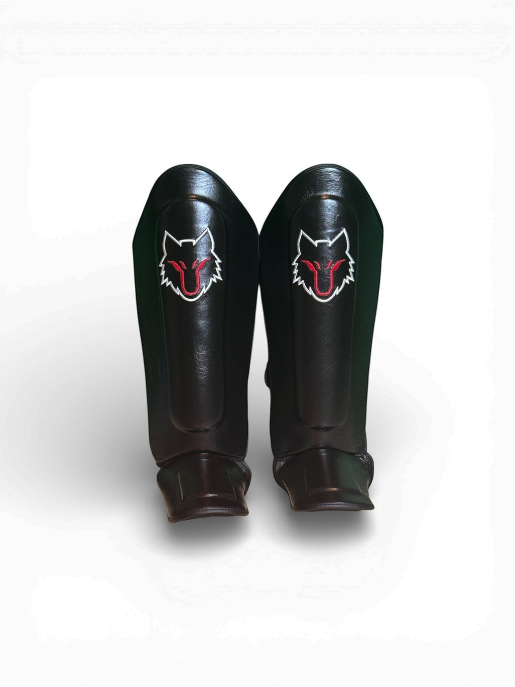 My Store black genuine cowhide leather shin guards with red and white wolf logo for Muay Thai, MMA, Kickboxing.