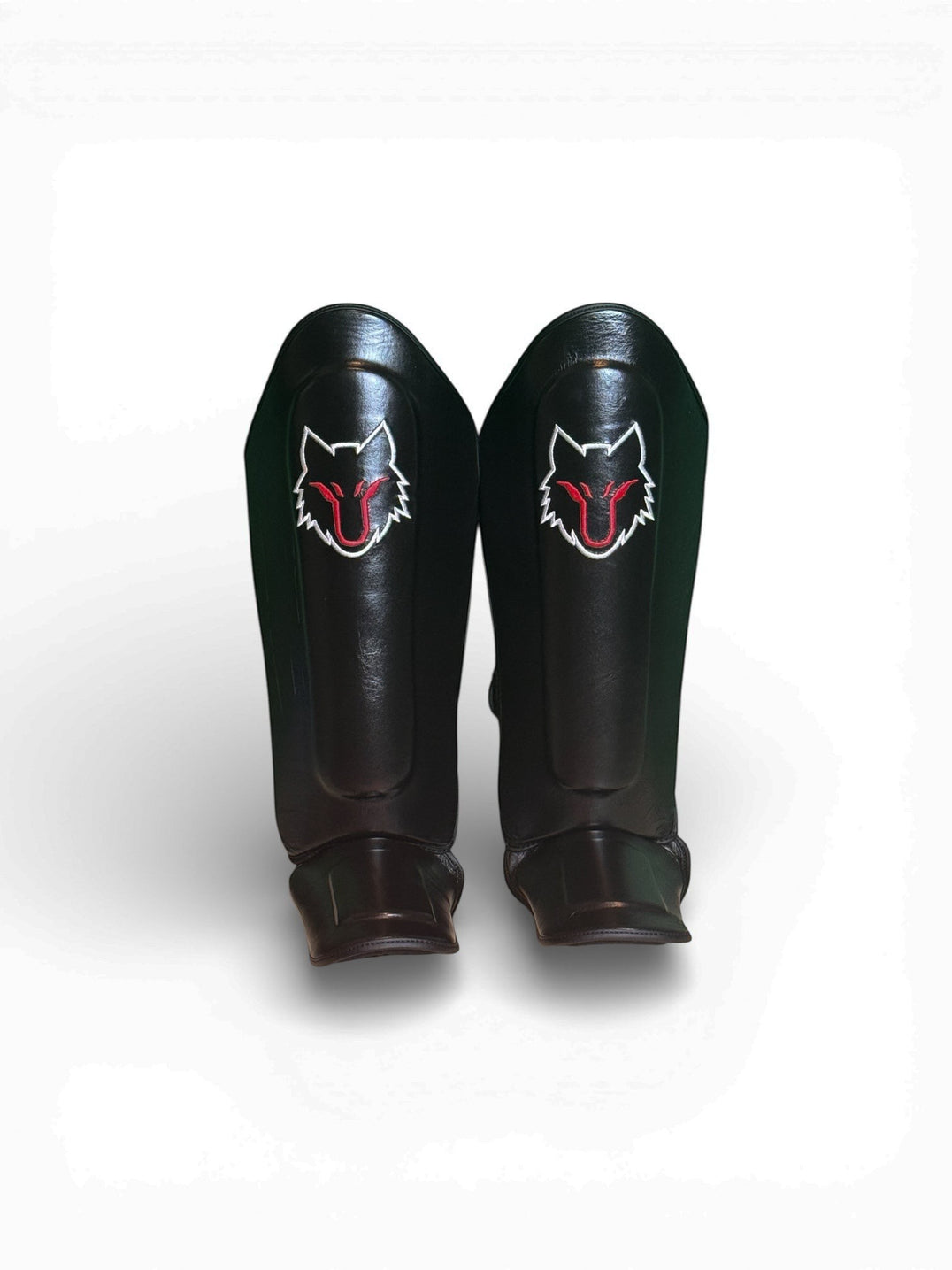 My Store black genuine cowhide leather shin guards with red and white wolf logo for Muay Thai, MMA, Kickboxing.