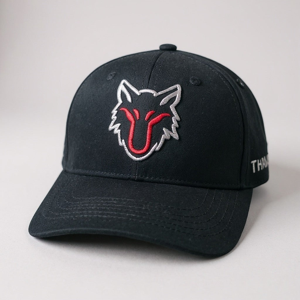 My Store black baseball cap with embroidered wolf head logo in red and white. Adjustable strap.