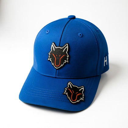 My Store blue baseball cap with dual black and orange wolf head patches. Adjustable strap for custom fit.