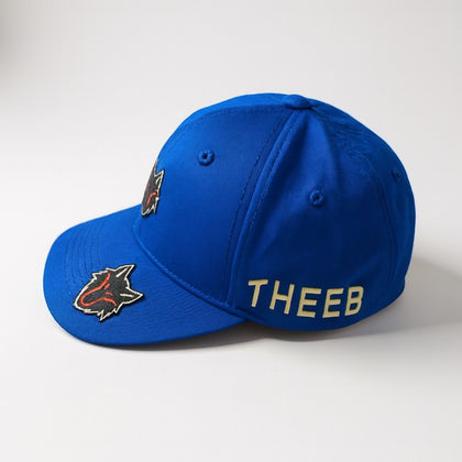 My Store blue baseball cap with dual THEEB wolf head logos and embroidered "THEEB" text. Durable fabric, adjustable fit.
