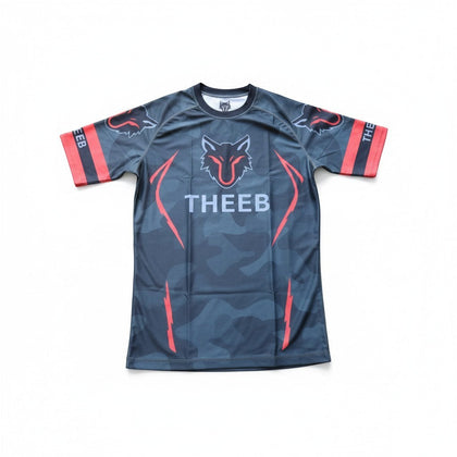 My Store THEEB adults' rash guard with grey camo print, red accents, and wolf logo. Compression fit, quick-dry fabric.