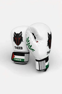THEEB Falastini boxing gloves in white PU leather with black wolf logo and Palestinian flag detail on wrist strap.