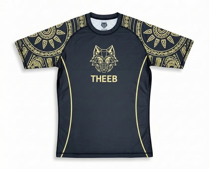 My Store THEEB Golden Age black rash guard with gold geometric wolf logo and ornate sleeve designs. Compression fit for BJJ, MMA, and training.