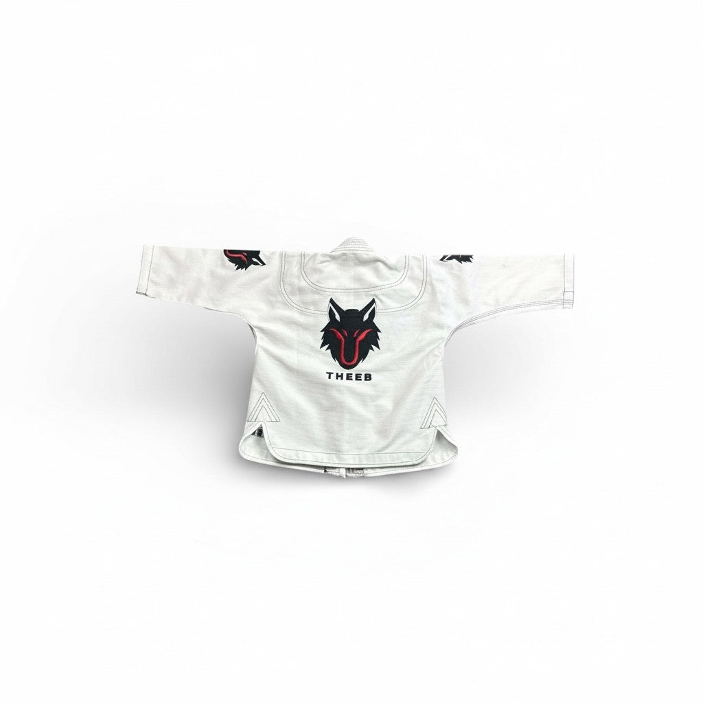 My Store THEEB Kids BJJ Gi, white 450 GSM cotton kimono with embroidered wolf logos and "THEEB" text.