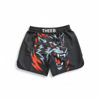 My Store THEEB black MMA shorts for kids with a fierce wolf graphic and red/grey accents. Elastic waistband.