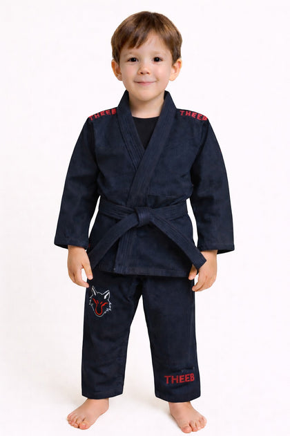 My Store THEEB Kids navy blue BJJ Gi, 450 GSM cotton, with red embroidery and wolf logo on pants.