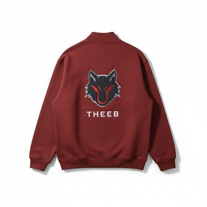 My Store THEEB maroon zip-up workout jacket with stand collar and embroidered wolf logo.